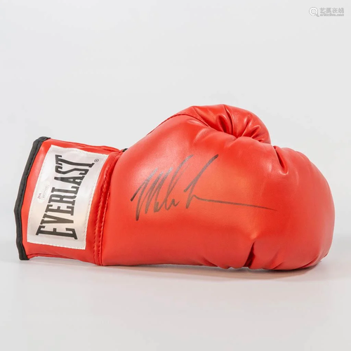 A signed boxing glove by Mike Tyson, with a JSA Witness