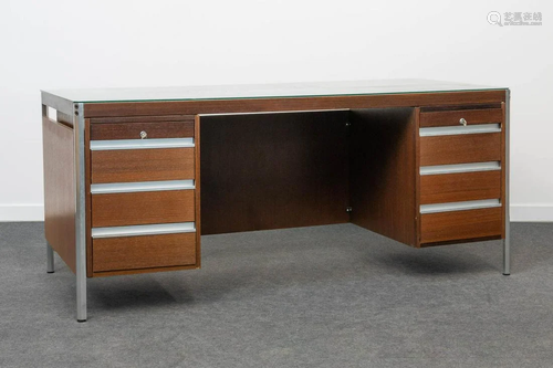 A mid-century desk made of wood, aluminium and glass