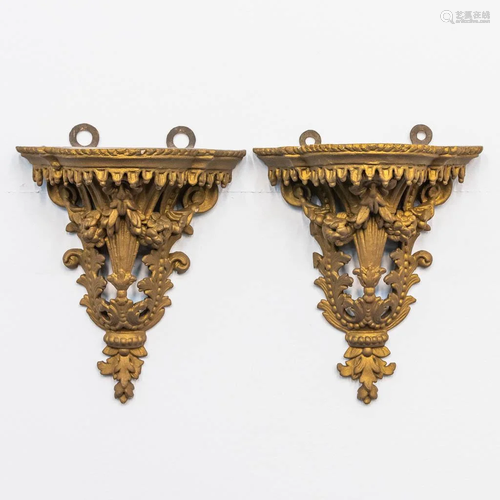 a pair of wall consoles, made of gilt wood and stuco.