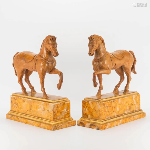 A pair of wood sculptured horses after Leonardo Da