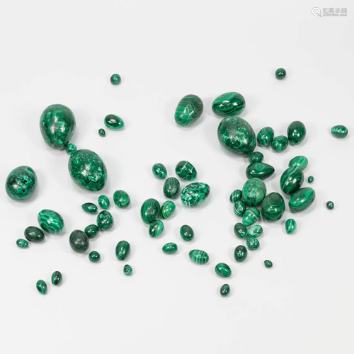 A large collection of green Malachite stone eggs. The