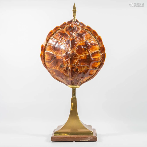 An antique table lamp, made of a turtle shell and