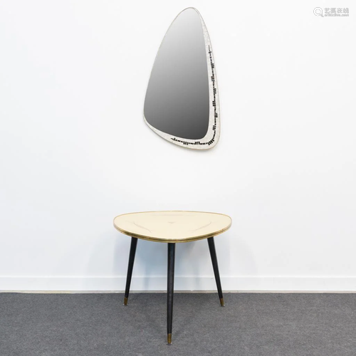 A mid-century coffee table and mirror with inlaid