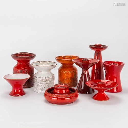 A collection of 9 ceramic candlesticks made by Perignem