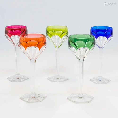 A collection of 5 cut crystal glasses in bright