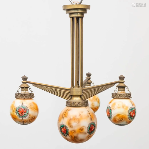 A decorative chandelier in art deco style with painted