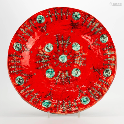 A bowl made of glazed faience, marked Huy Lasiaux. (4 x