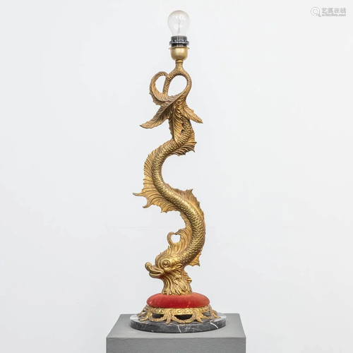 A table lamp made of bronze on a marble base in the