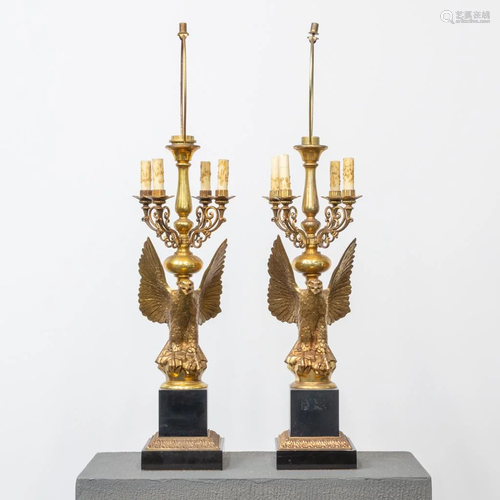 A pair of Deknudt table lamps made from brass, eagle on