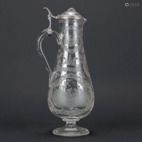 An antique pitcher made of Boheme glass with etched