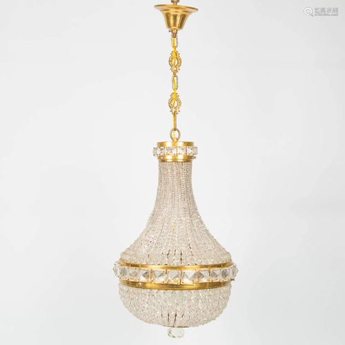 A Sac-�-Perles chandelier made of brass and glass in