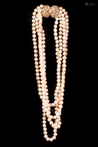 4 strand pearl necklace with large gold and diamond