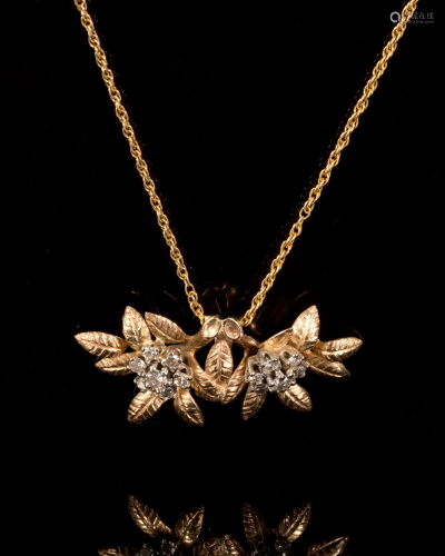 A Vintage 14K Gold and Diamond Flower Pendant with