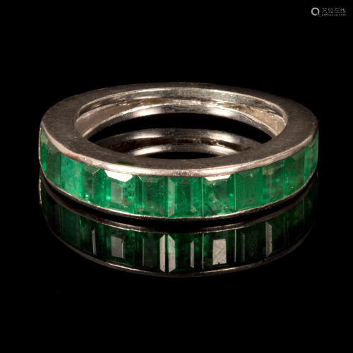 A Platinum and Emerald Semi-Eternity Band Ring