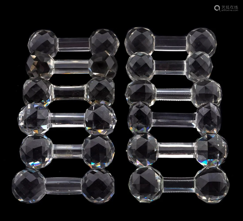 TWELVE MISC. FACETED CRYSTAL KNIFE RESTS