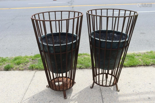 A Large Pair Of Antique Iron Footed Planters