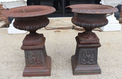 A Vintage Pr Of Cast Iron Urns On Stands.