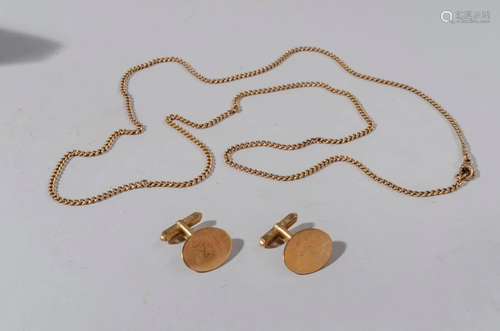 A pair of gold cufflinks with chain marked 9k.