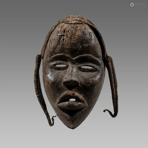 African Ivory Coast Wooden Mask With False hair.