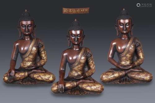 a group of three chinese gilt bronze seated buddha statues