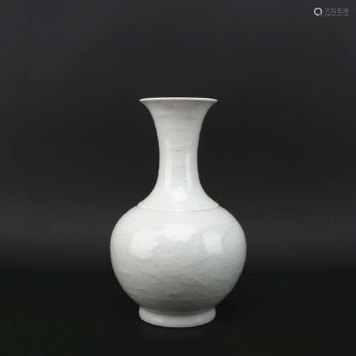 A white glazed 'dragon and phoenix' vase