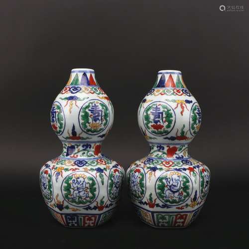 A pair of Wu cai 'figure' gourd-shaped vase