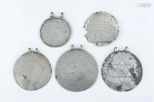 A GROUP OF FIVE LARGE CIRCULAR AMULETS