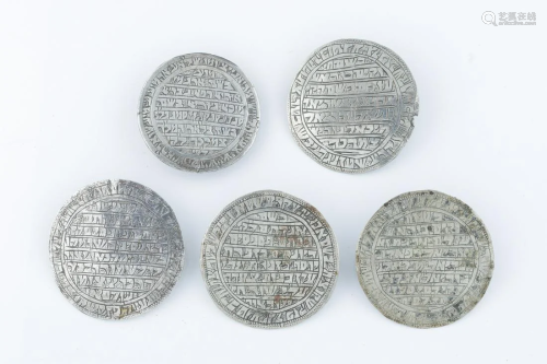 A GROUP OF FIVE CIRCULAR SILVER AMULETS