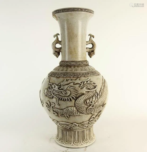 TALL WHITE PORCELAIN VASE OF RAISED DRAGON DESIGN