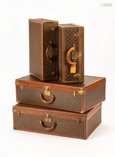 A Group of Four Louis Vuitton Hard-Sided Suitcases