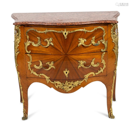 A Louis XV Style Bombe Commode with Sunburst Veneer and