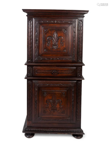 A Louis XIII Style Carved Walnut Cabinet