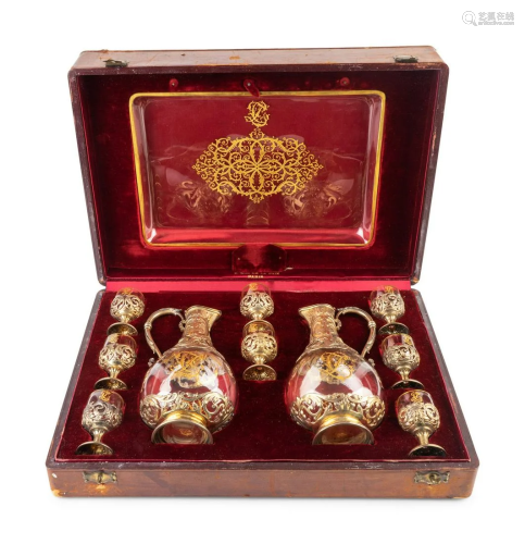 A French Silver Gilt and Crystal Decanter Set Height of