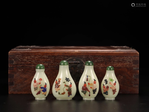 A Set of Four White Jade Snuff Bottles