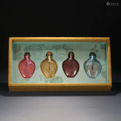 A Set of Glassware Inscribed Snuff Bottles, 4 Pieces