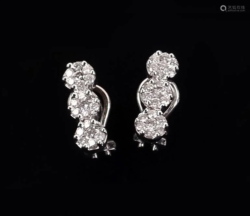 A Pair of Diamond Earclips.