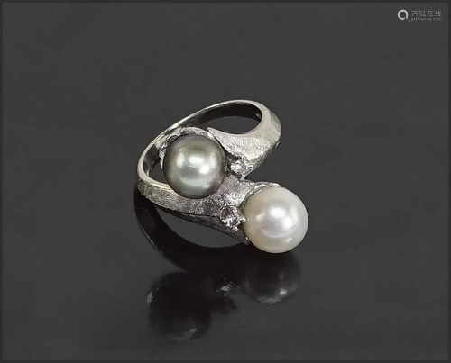 A Pearl & Diamond Bypass Ring.