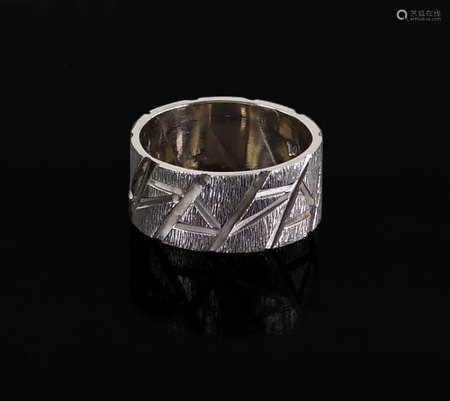 A 14 Karat White Gold Ring.