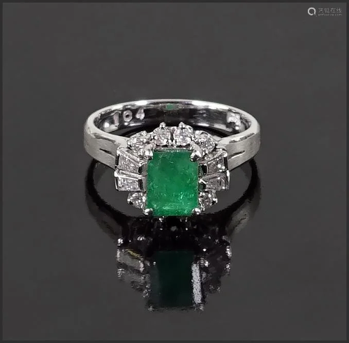 An Emerald and Diamond Ring.