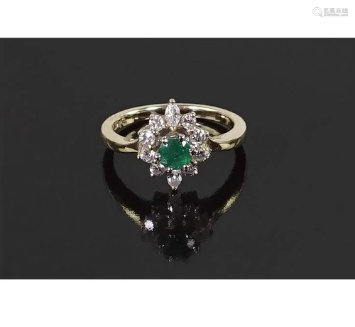 An Emerald and Diamond Ring.