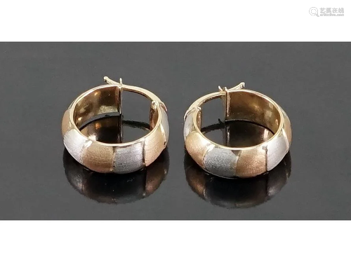 A Pair of Tri-Color 14 Karat Gold Hoop Earrings.