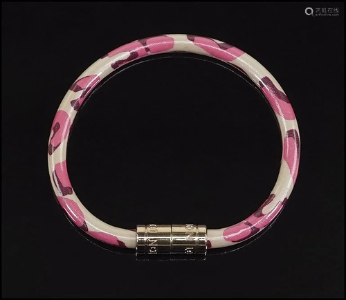 A Louis Vuitton Sprouse Leopard Bracelet.