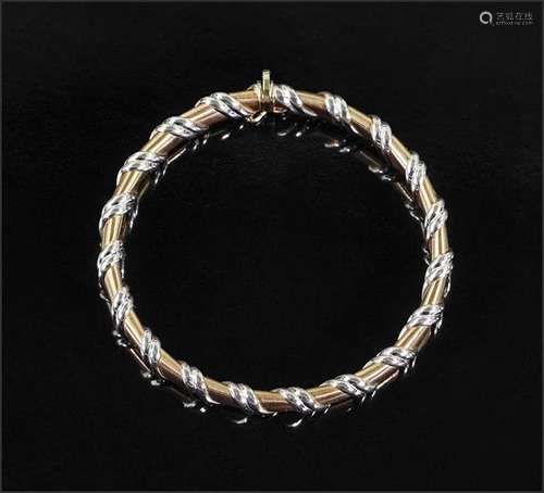 An Italian 14 Karat Gold Bangle Bracelet.