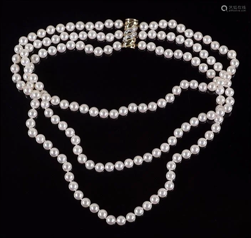 A Pearl and Diamond Necklace.