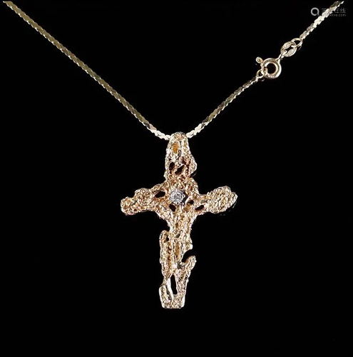 A Diamond Crucifix Pendant.