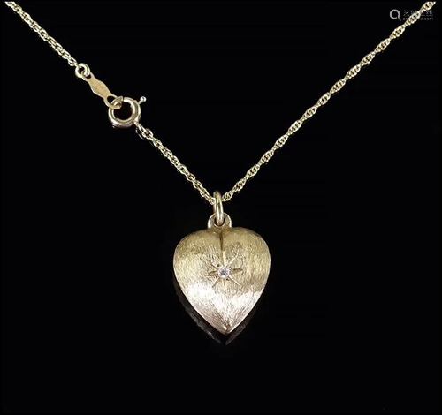 A Heart Pendant Necklace.