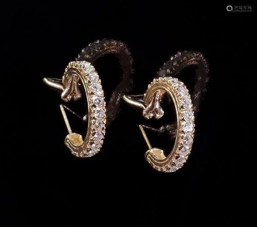 A Pair of Diamond Hoop Earrings.