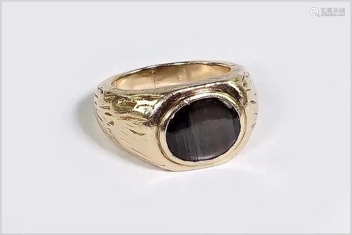 A Black Star Sapphire Ring.