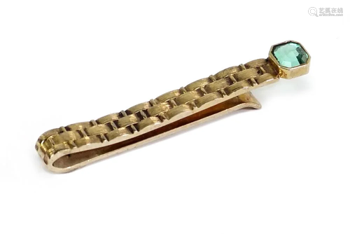 A 14 Karat Yellow Gold Tie Clip.