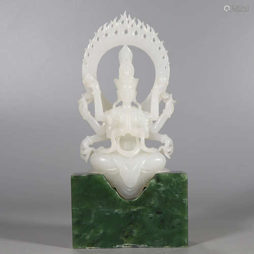 A White Hetian Jade Carved Eight Arms Guanyin Statue